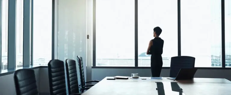 woman standing in corporate board room